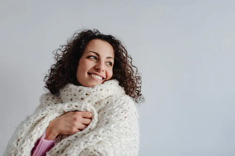 Chunky knit scarf wrapped around a coat